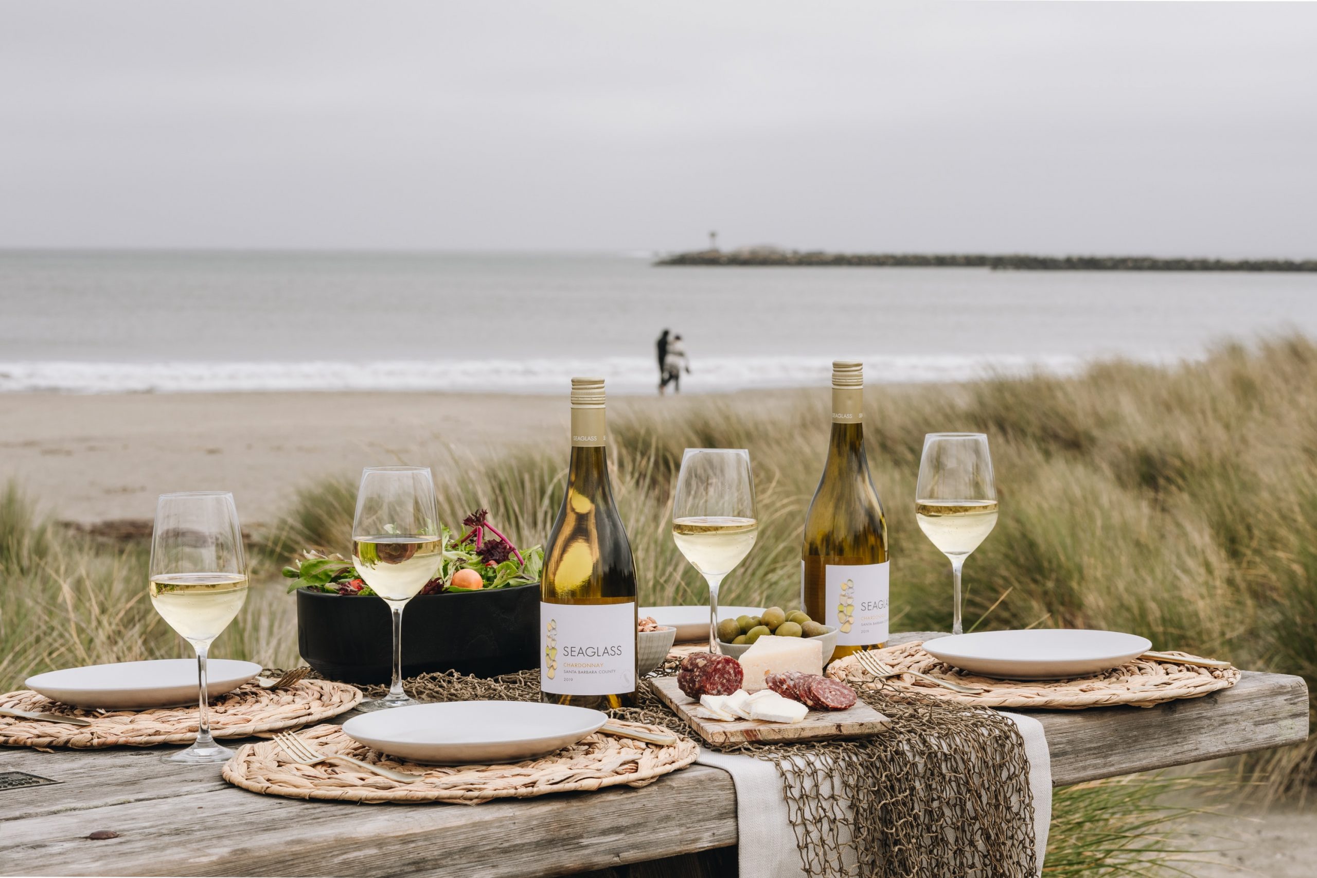 wine bottle and wine glass on table